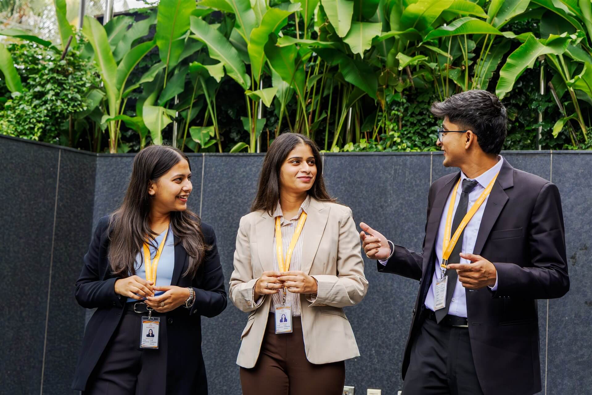 ISBR students in business attire talking on campus